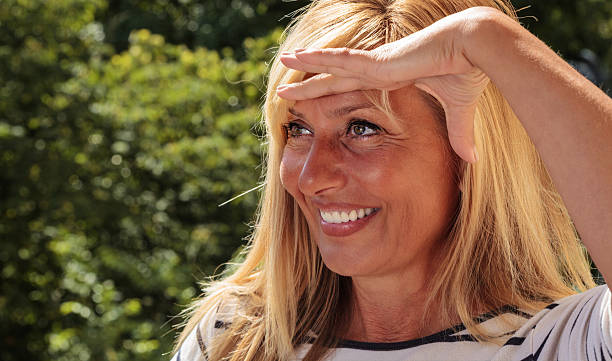 istock Pretty Mature Woman Looking Faraway 481011160