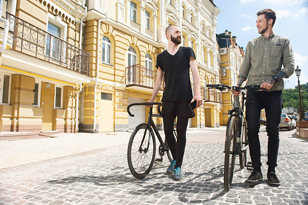 istock Two young hipster guys are walking across street 481013926
