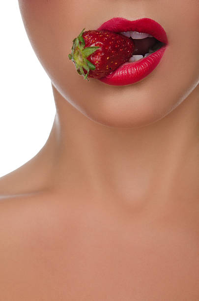 istock sexy female lips with strawberries 481014426