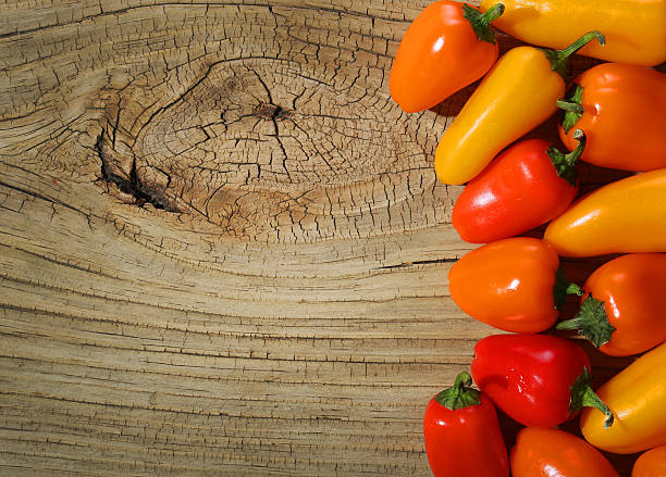 istock Peppers on wooden background 481016469