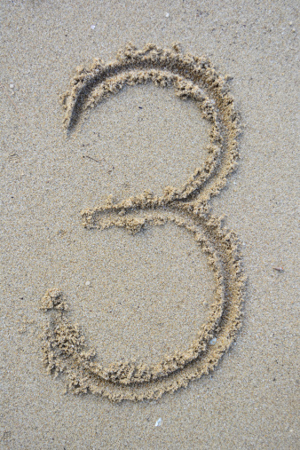 Number three write on beach in Thailand.