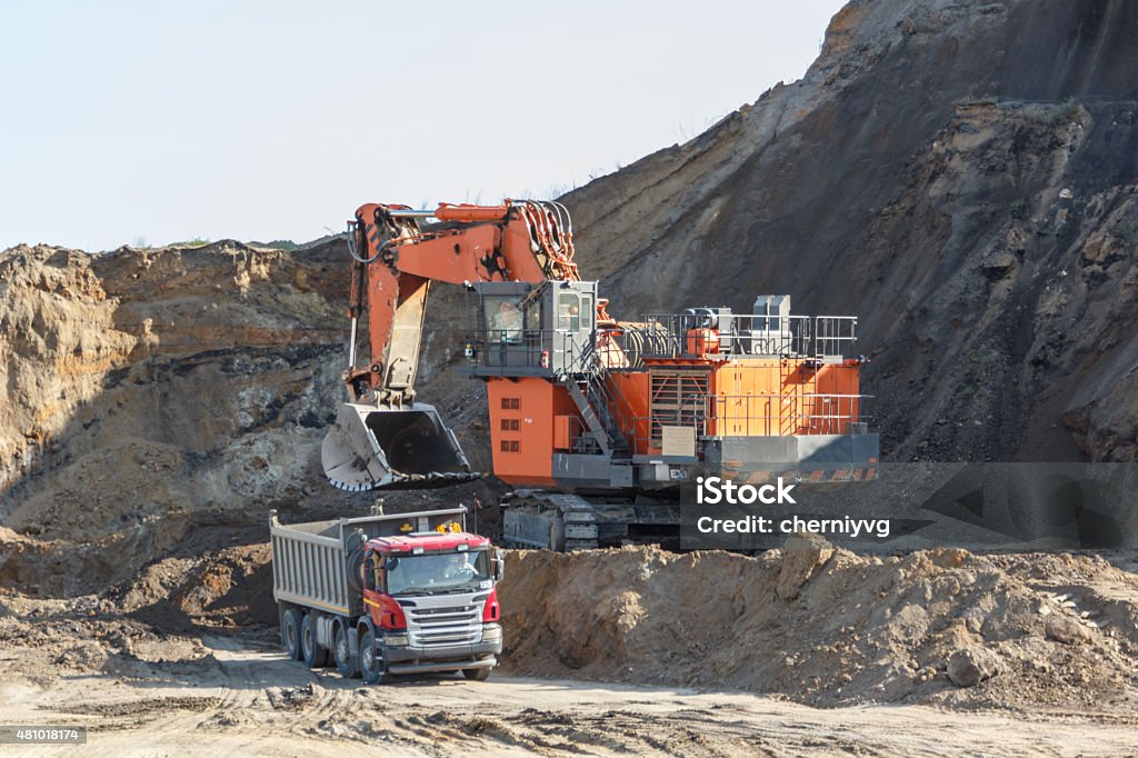 Loading mining trucks an excavator 2015 Stock Photo