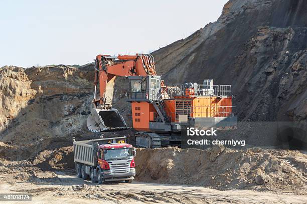 Loading Mining Trucks An Excavator Stock Photo - Download Image Now - 2015, Activity, Business