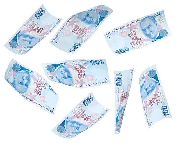 Flying 100 Turkish Liras on white background stock photo