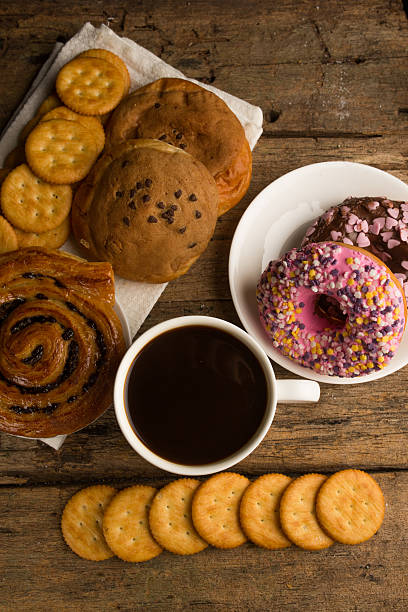 istock Cup of coffee on a wooden board and biscuits 481023306