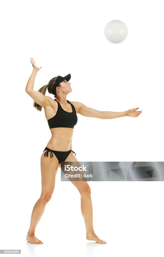 Female volleyball player serving the ball Female volleyball player serving the ballhttp://www.twodozendesign.info/i/1.png Athlete Stock Photo