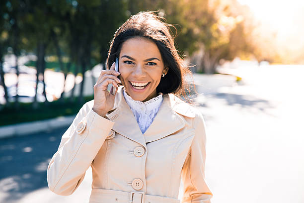 istock Laughing woman talking on the phone 481024794