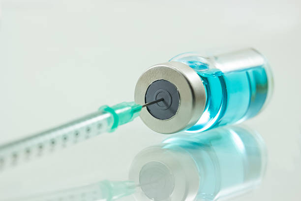 istock medical syringe and medicine  isolated on white background 481027462