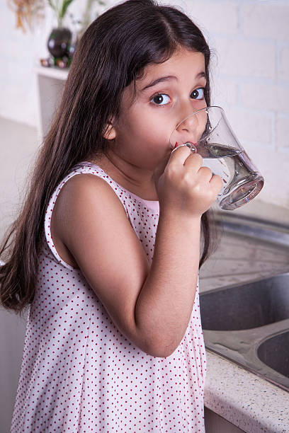 istock Beautiful girl in the nice white kitchen (series) 481028354