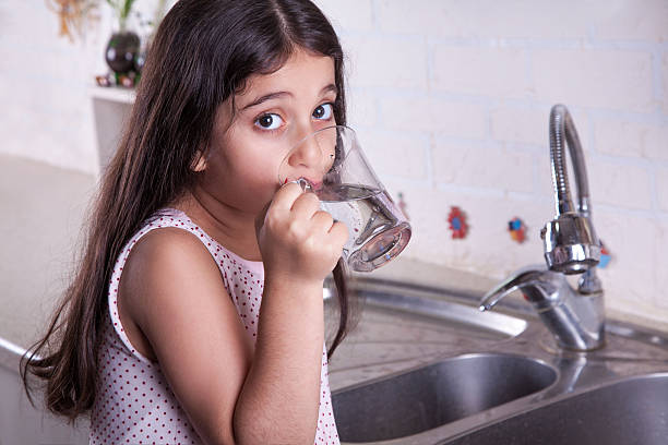 istock Beautiful girl in the nice white kitchen (series) 481028356