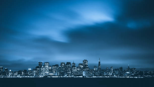 Twilight in San Francisco San Francisco skyline at twilight seen from Treasure Island. dark blue sky stock pictures, royalty-free photos & images