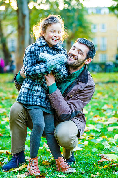 istock Father and daughter having fun in park 481028785