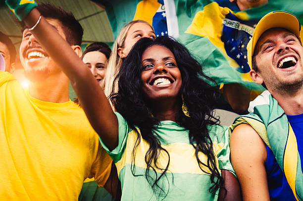 Brazilian Fans at Stadium Brazilian Fans at Stadium international team soccer stock pictures, royalty-free photos & images