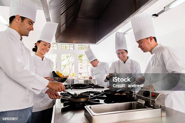 Group Of Chefs Cooking Stock Photo - Download Image Now - Chef, Teamwork, Education