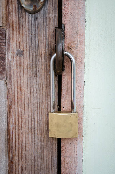 istock Old master key on wood door 481032681
