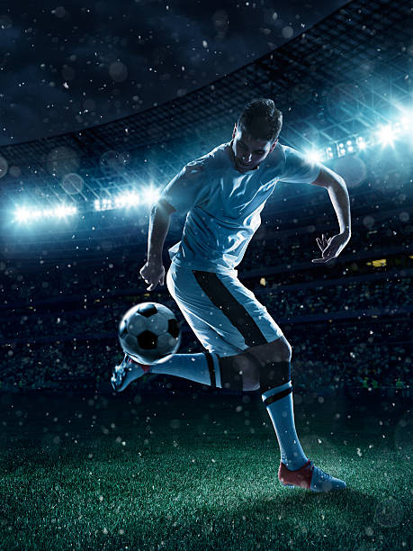 istock Soccer player tackling a ball on stadium 481032919