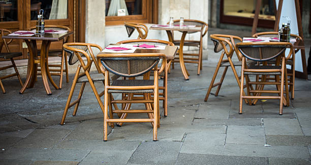 istock wooden chairs of a cafe 481034550