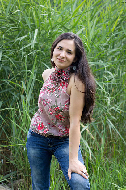 istock Smiling girl against a green cane 481039781