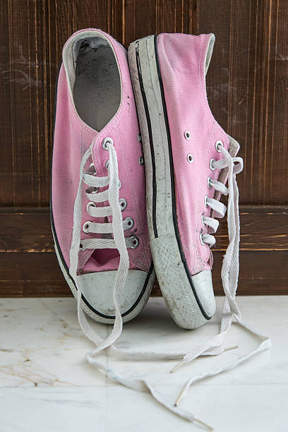 istock Retro sneakers left on wooden floor 481039830