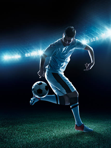 istock Soccer player tackling a ball on stadium 481042927