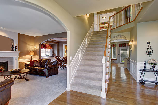 istock elegant entry way with stairs, and arched door way. 481043738
