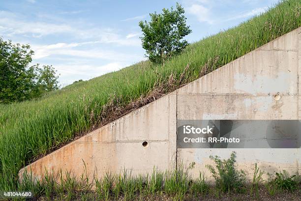 Concrete Embankment In A Grassy Area Stock Photo - Download Image Now - 2015, Cement, Concrete