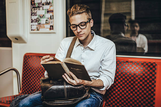 istock Young hipster reading a book on the underground 481045390