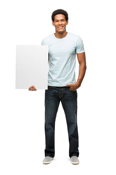 istock Casual young man holding sign 481047243