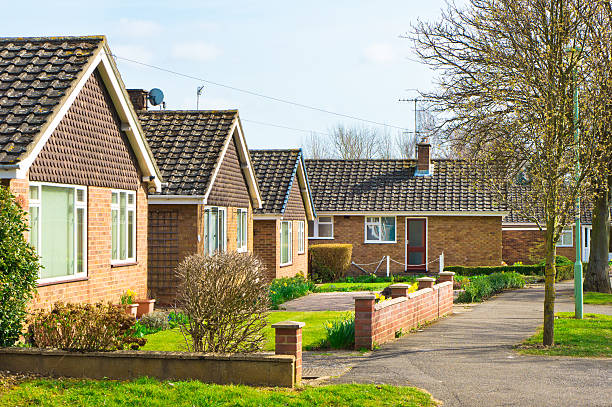Bungalows Bungalows in a suburban UK neighbourhood in spring bungalow stock pictures, royalty-free photos & images