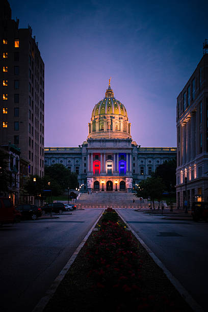 Pennsylvania State Captiol Building at Night Pennsylvania State Captiol Building displaying red, white and blue for the July 4th.  harrisburg pennsylvania stock pictures, royalty-free photos & images
