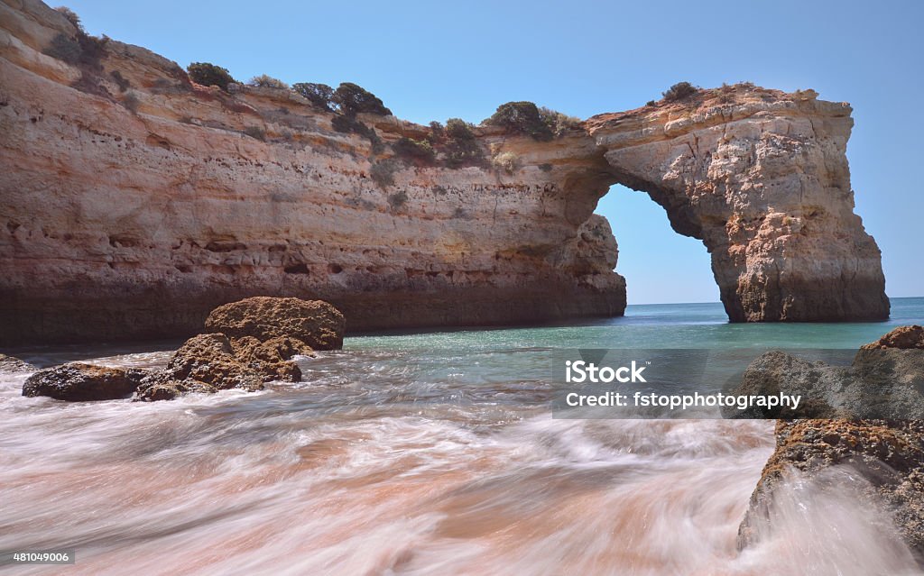 Algarve Beach Natural Arch Long exposure shot of Albandeira Beach on the Algarve on the coast line Portugal 2015 Stock Photo