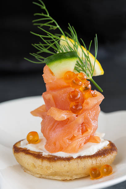 istock Smoked salmon and sour cream appetiser, garnished with dill 481049259