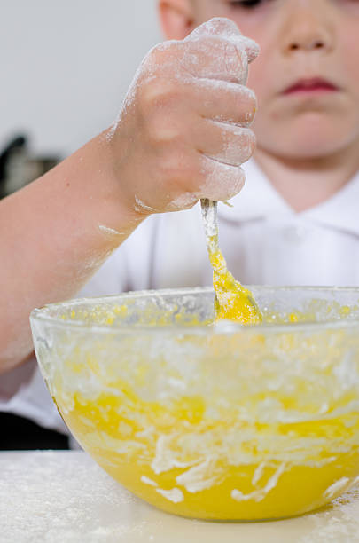istock Little boy mixing cake ingredients 481051666