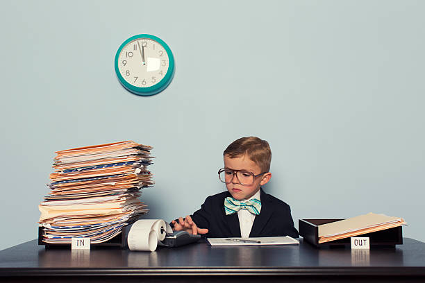 istock Young Boy Accountant Crunches Number at the Office 481054119