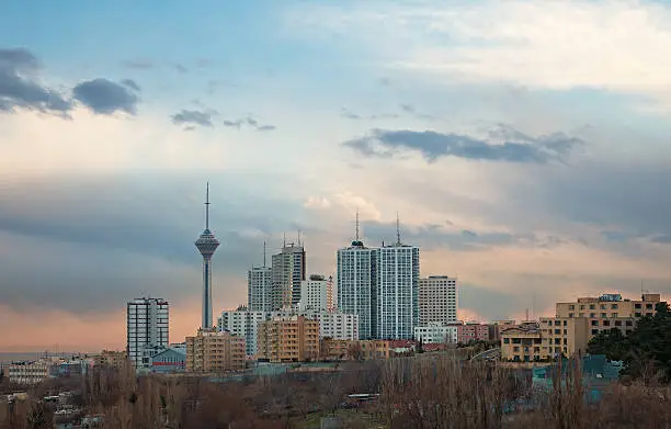 Skyline of Tehran with Milad Tower among high rise buildings.