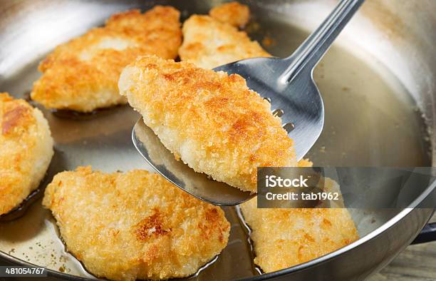 Golden Fried Fish In Pan Stock Photo - Download Image Now - Deep Fried, Frying Pan, Slice of Food