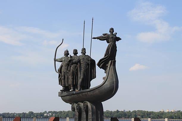 Irkutsk, Russia — The monument symbolizing poet Anna Akhmatova and the children of the Siege of Leningrad stands covered with snow near the Pedagogical Institute in Irkutsk. Installed in 2007, the sculpture by Alexander Shipitsyn represents not a literal portrait of Akhmatova but a collective image of motherhood, compassion, and remembrance of wartime suffering. The location near the teacher training university highlights the values of empathy and moral education. Date: 29 October 2022
