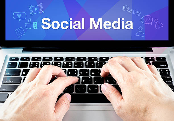 istock hand type on laptop with social media on screen 481058102