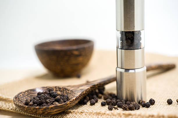 istock Pepper grinder and black peppercorn 481062812