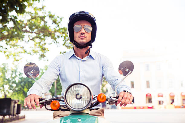 istock Man in helmet riding on scooter 481063310
