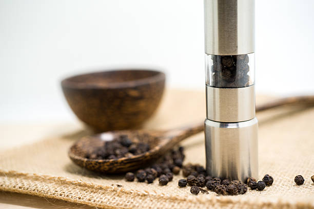 istock Pepper grinder and black peppercorn 481063492