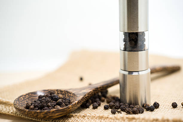 istock Pepper grinder and black peppercorn 481063496