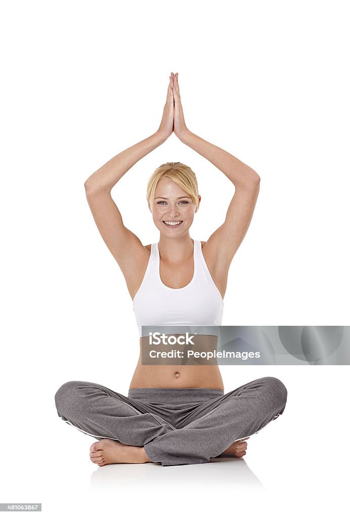 Healthy mind and attitude Portrait of an attractive young woman doing yoga 20-24 Years Stock Photo