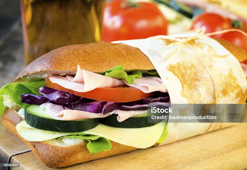 Delicious sandwich Delicious sandwich stuffed with ham,cheese and salad.Selective focus on the front part of sandwich Bread Stock Photo