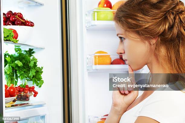 Happy Woman And Open Refrigerator With Fruits Vegetables Stock Photo - Download Image Now