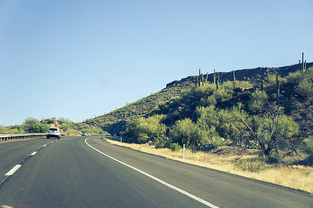 istock Truck driving through desert plains 481069688