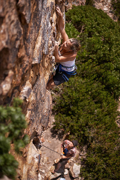 istock Using every ounce of her strength to reach the top 481069979
