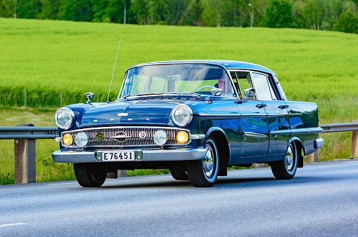 Ronneby, Sweden - June 26, 2015: Veteran car street cruise on public roads. Opel kapitan blue.