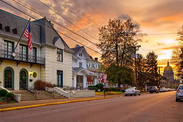 Residential street in downtown Charleston, West Virginia with the Capitol building in the background at sunrise.