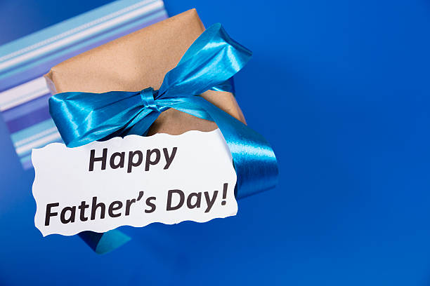 istock Holidays:  Father's Day gift for dad on blue background. 481072473